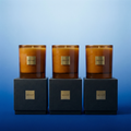 VEMOT Gift Set — 3 candles standing on top of 3 gift boxes in a row