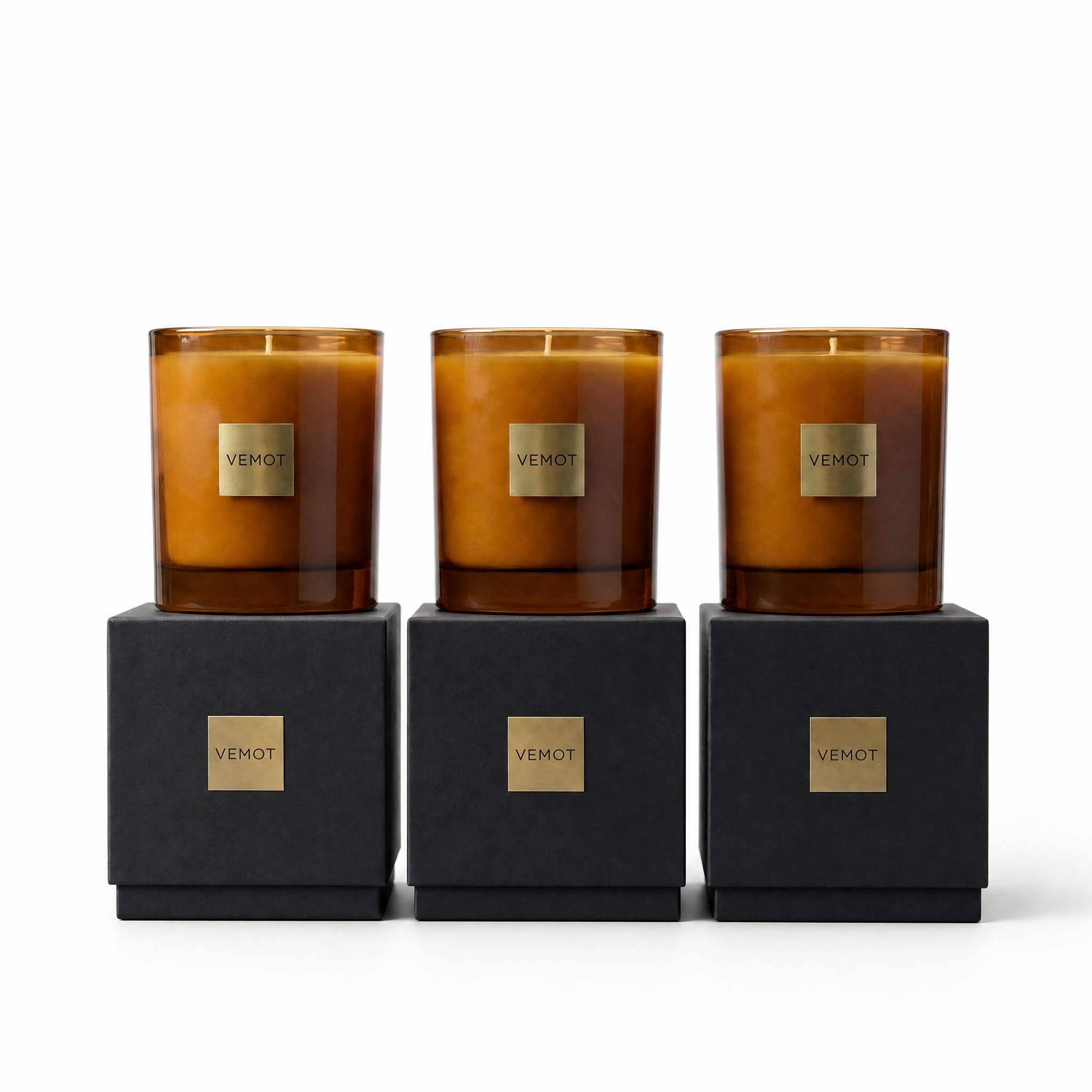 set of three candles on white background